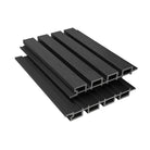 A stack of premium composite slatted cladding in various colors including beige, brown, gray, and black.