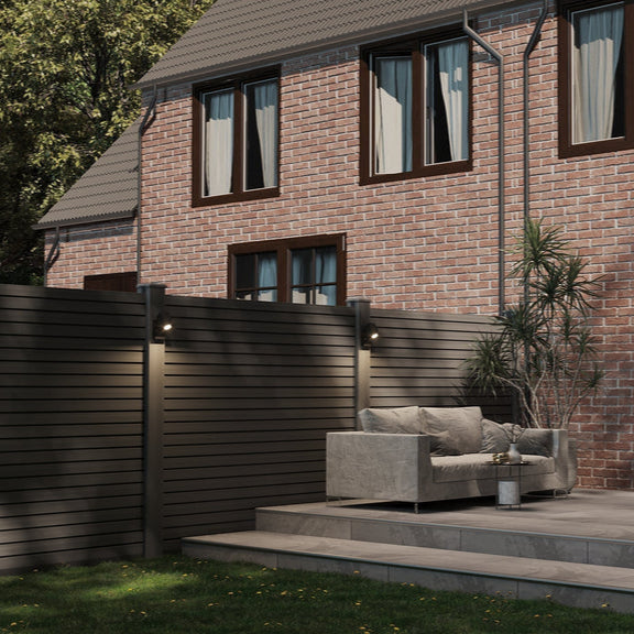 Brick house with outdoor seating area and garden