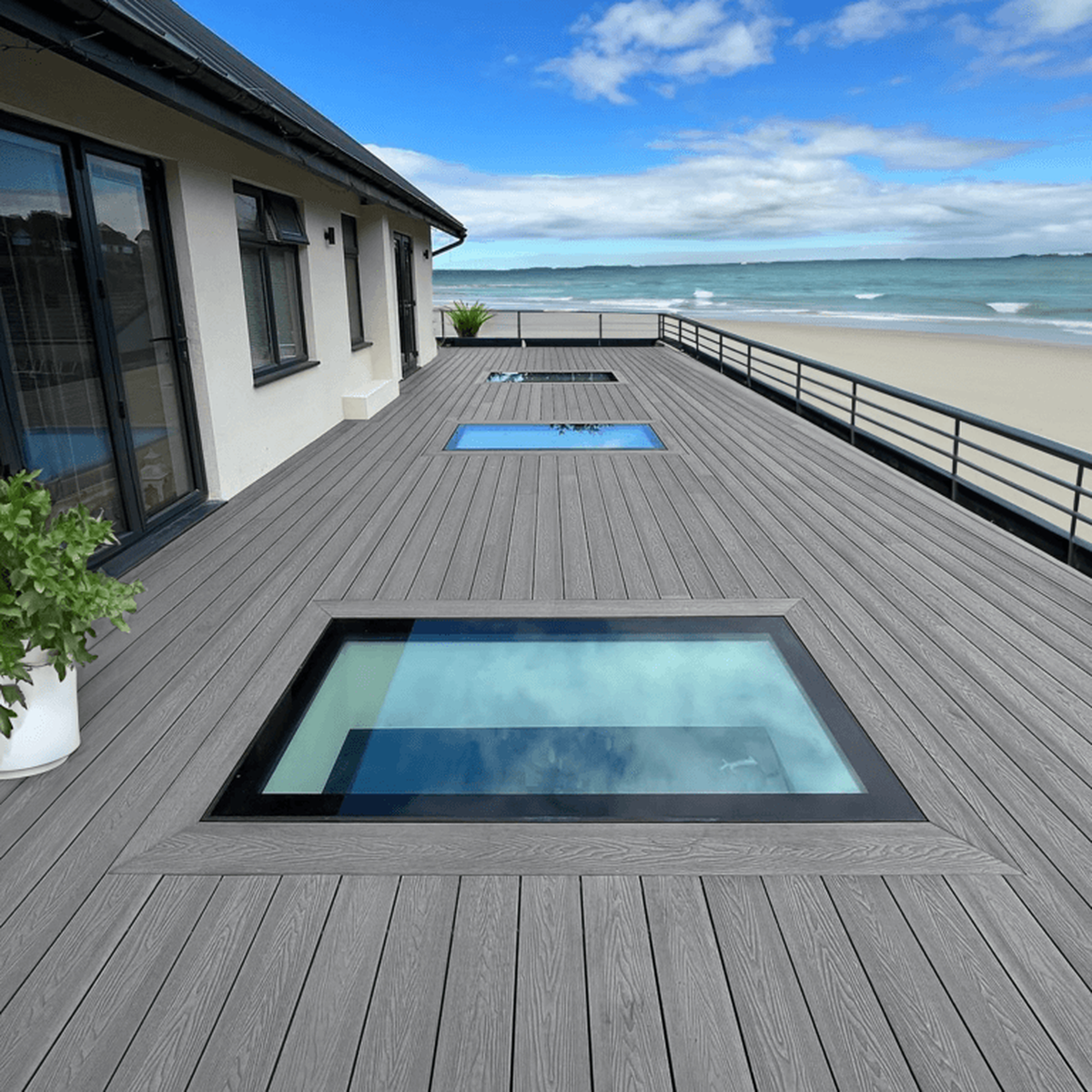 Composite deck with a glass floor overlooking the ocean