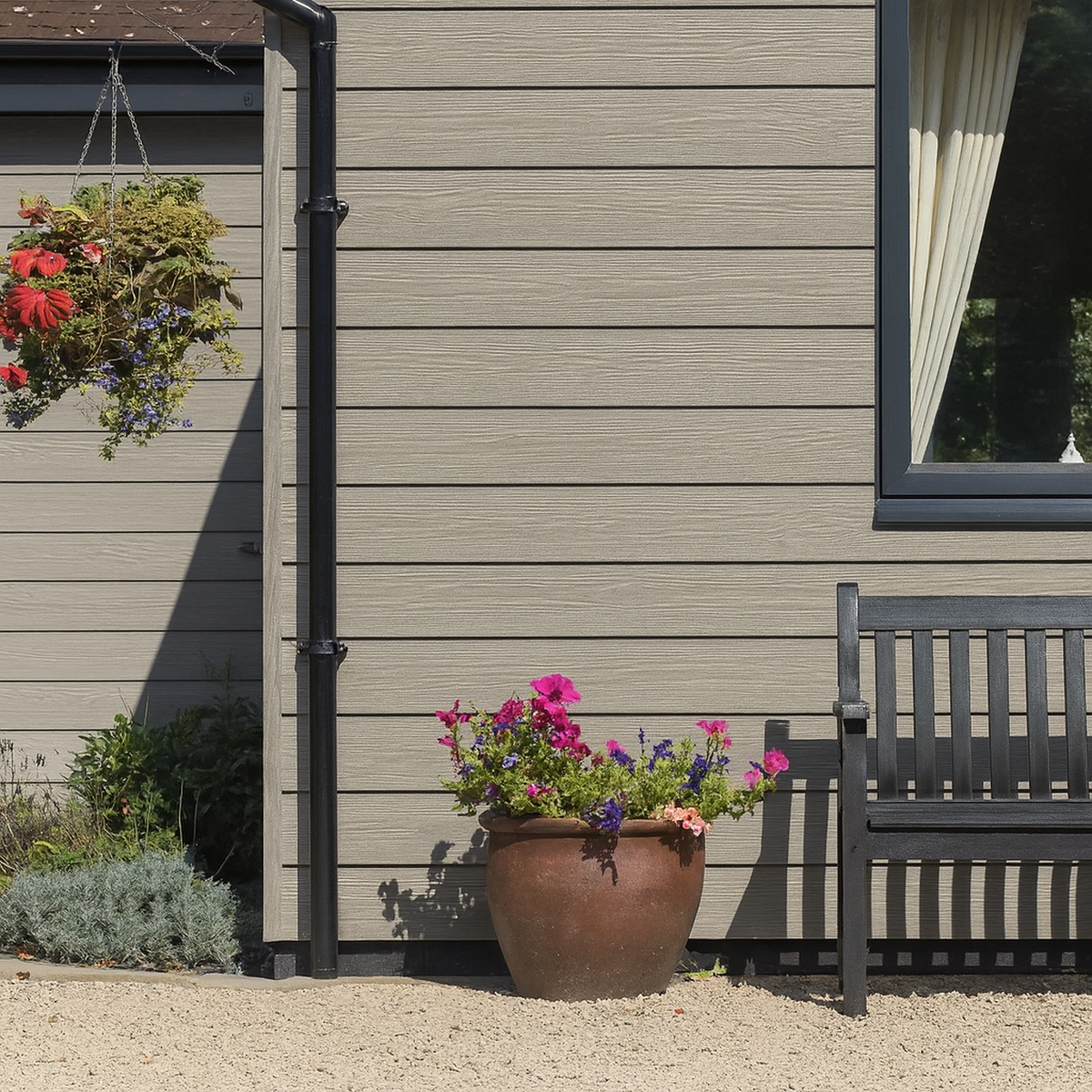 Light woodgrain shiplap cladding fitted horizontally beside a window and bench