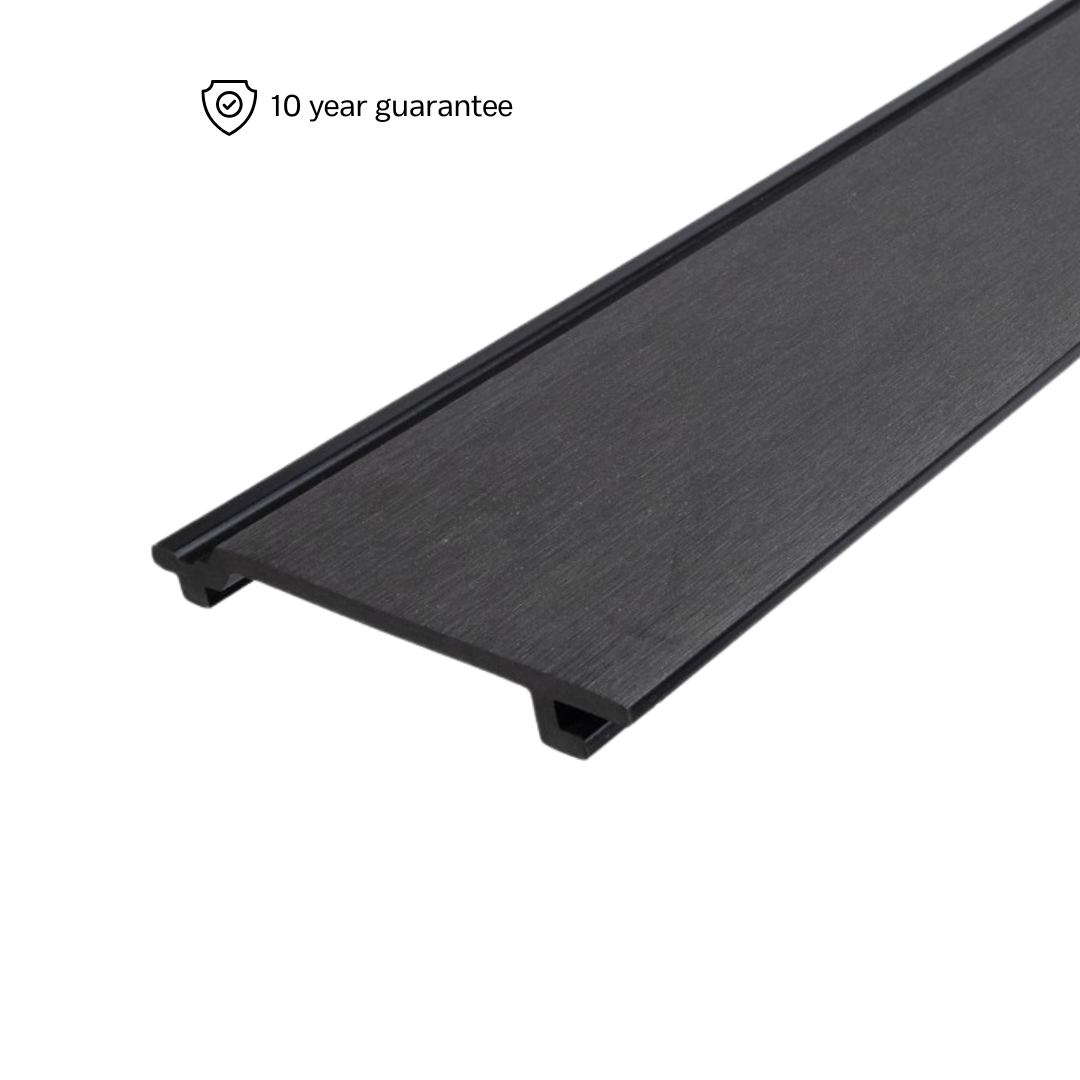 A piece of black composite cladding with a brushed texture, indicating it is a smooth, modern siding material.