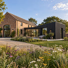 Charcoal Black Prestige slatted cladding — installed architectural visualisation