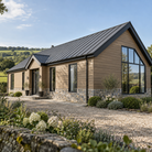Oak Signature woodgrain cladding, horizontal installation on a house — illustrative project scene