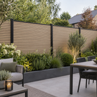 Natural Oak slatted composite fencing with narrow slat faces and slim black rails — generated garden illustration